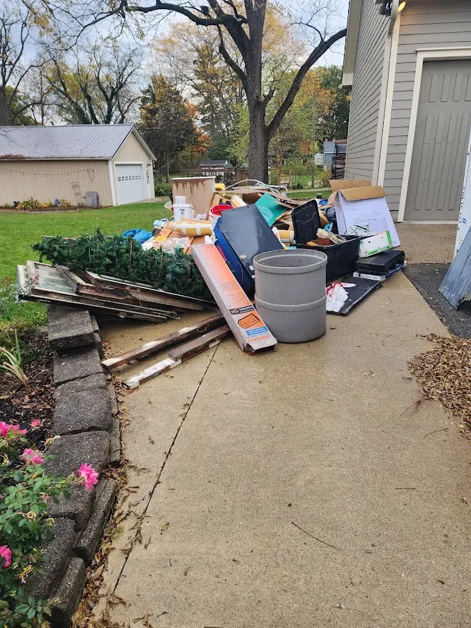 Dumpster being loaded with debris for Roofing Dumpster Rental in Hempfield